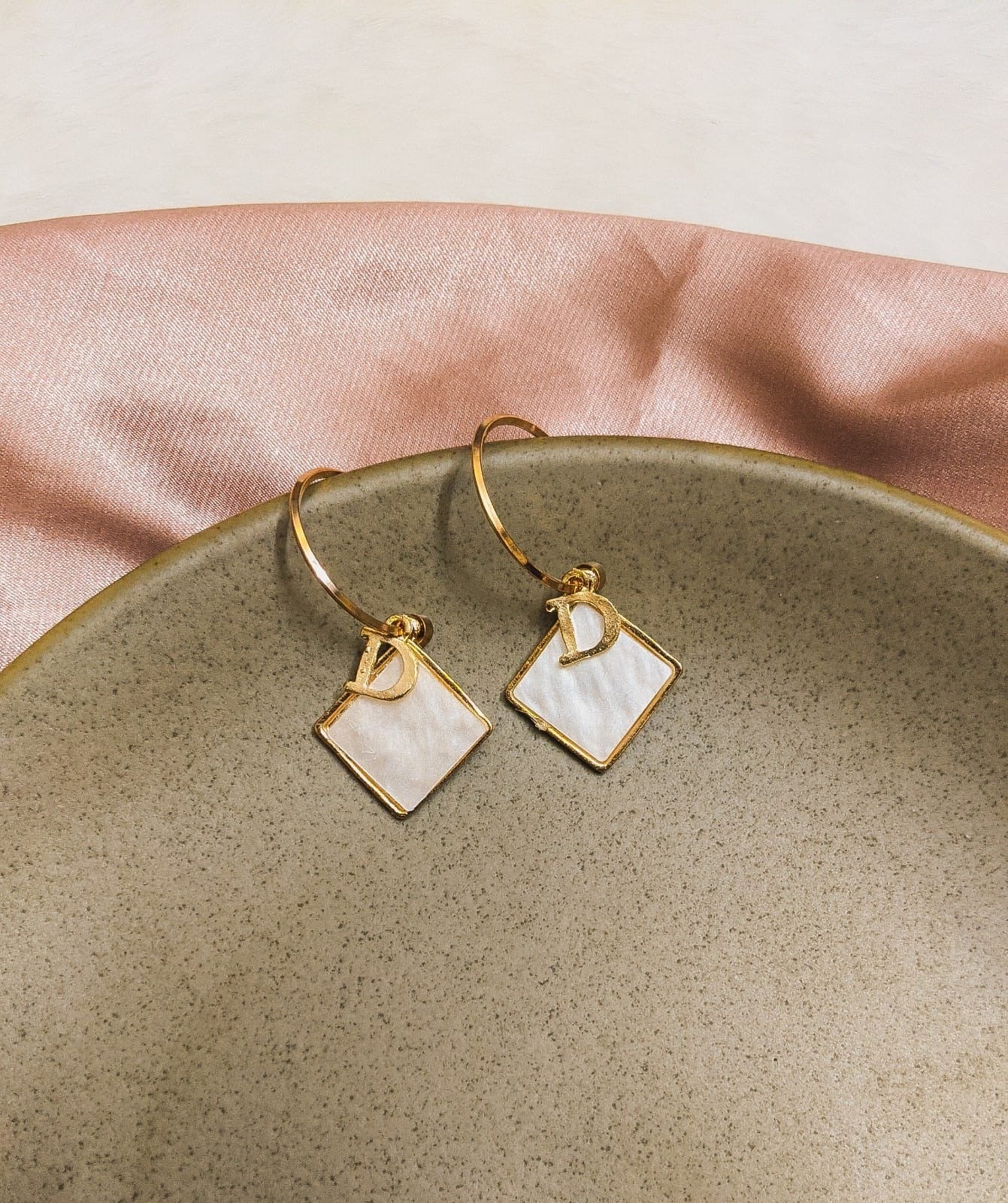 Dior logo and shell worked earring